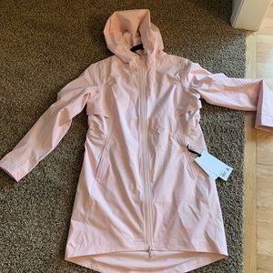 Never worn, new with tags LULULEMON rain coat.